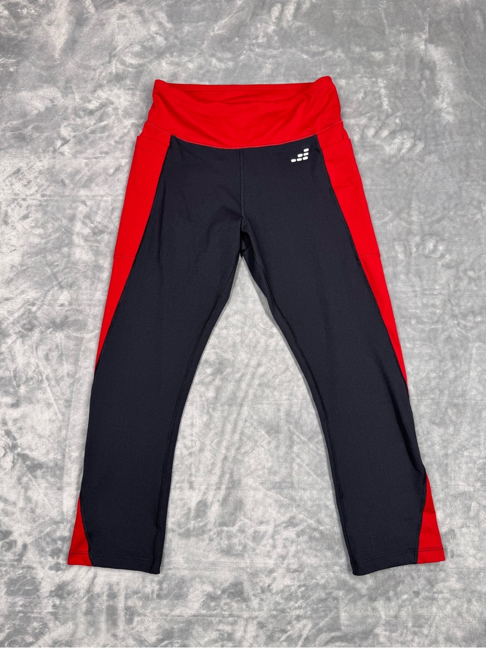 Black with red Athletic leggings capris with side pockets.